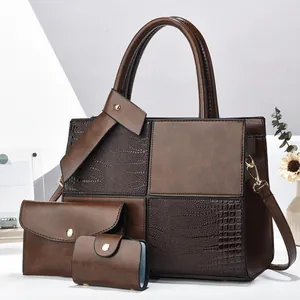 Three-piece brown leather handbag set with croc-embossed stitching and tote design