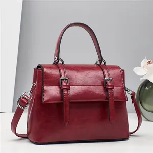 Vintage burgundy leather handbag with large capacity and silver metal buckles