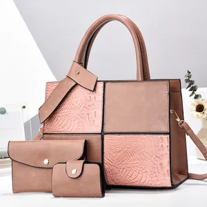 Three-piece handbag set in pink and brown faux leather with crocodile texture and gold hardware