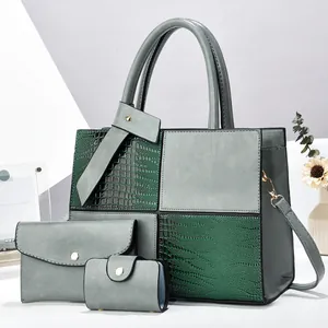 Three-piece women's tote bag set in grey and dark green patchwork with crocodile pattern