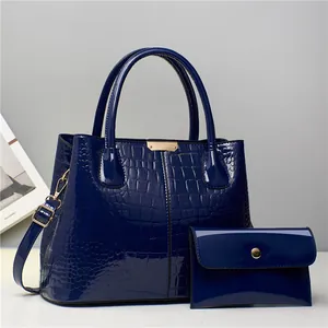 Navy blue crocodile embossed patent leather tote bag set with golden hardware details