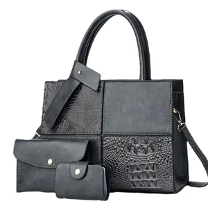 Three-piece black crossbody bag set with crocodile texture patchwork and gold hardware