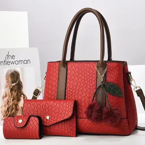 Three-piece red woven tote bag set with cherry charm and leather handles