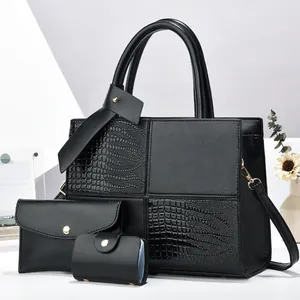 Three-piece black tote bag set with crocodile texture patchwork and gold hardware