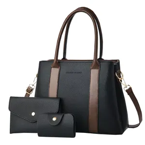 Three-piece black and brown contrast color leather tote bag set with gold hardware