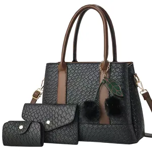 3-piece black woven tote bag set with cherry plush charm and brown leather handles