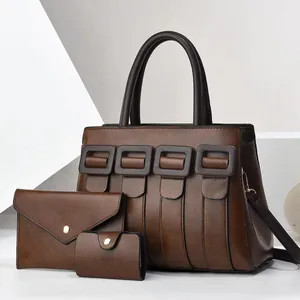 Three-piece brown faux leather tote set with crossbody pouch and card holder for women
