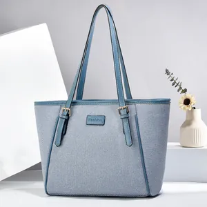 Stylish light blue denim tote bag for women with gold buckles and large capacity