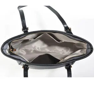 Top view of large black tote bag with textured finish and spacious interior layout