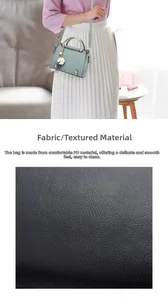 Detailed view of light green PU leather fabric with a smooth texture and daisy charm
