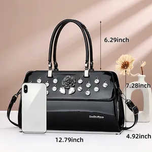 Elegant black patent leather handbag with diamond-encrusted rose and detailed dimensions