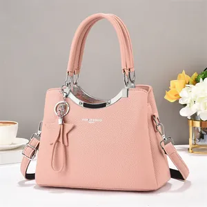 Pink lychee texture leather handbag with star charm and silver metal bar accent