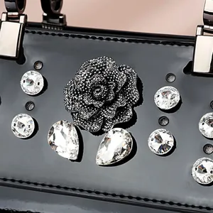 Elegant black patent leather handbag with 3D rose and crystal diamond decorations