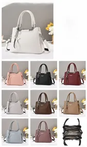 Detailed view of the large capacity shoulder bag interior and nine available color options