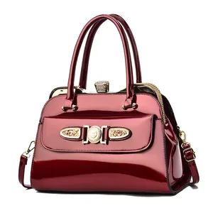 Deep red glossy patent leather handbag with sparkling rhinestones and gold hardware