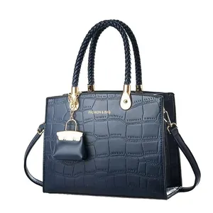 Dark blue crocodile pattern tote bag with woven handles and mini pouch accessory