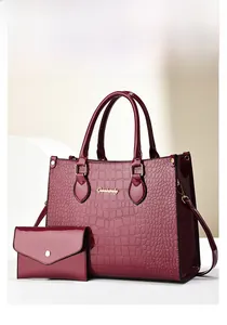 Close-up of wine red crocodile pattern tote bag set with matching small coin purse