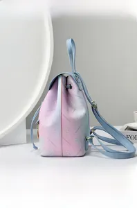 Detail of gradient rainbow faux leather backpack with floral print and drawstring closure