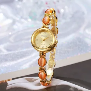 Reloj de cuarzo dorado para mujer con brazalete de piedra de ojo de gato naranja y esfera romana