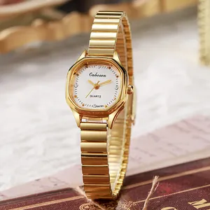 Elegant women's gold bathtub-shaped watch with bamboo-style steel band and crystal markers