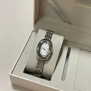 Vintage silver quartz watch for women with oval dial and metallic chain strap in a gift box