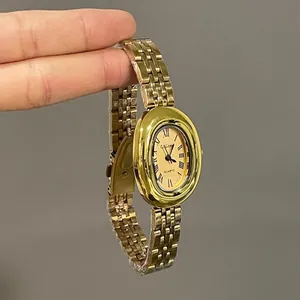 Elegant gold quartz watch for women with oval dial and roman numerals on metal strap