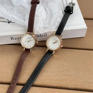 Elegant ladies quartz watch with thin leather strap and rose gold rhinestone dial