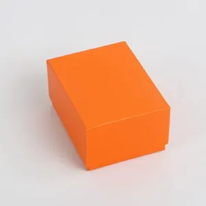 Classic bright orange rectangular watch gift box with textured surface and lid