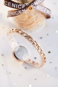 Macro detail of rose gold watch band with elegant metal links and luxury gift background
