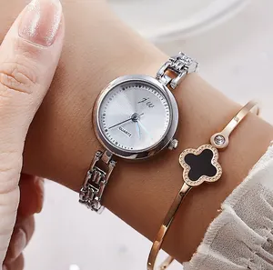 Elegant women's quartz watch with silver metal strap and clover bracelet set