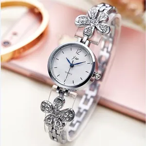 Elegant women's silver quartz watch with rhinestone flower bracelet and blue dial hands