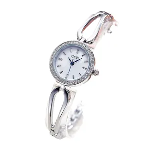 Fashion silver steel quartz watch for women with rhinestone bezel and hollow band