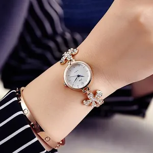 Rose gold quartz fashion watch for women with flower shaped rhinestone bracelet strap