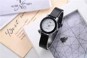 Detailed close-up of a stylish jw A-5707 watch with a white dial and black leather strap