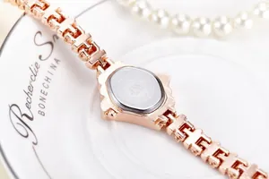 Macro view of JW-736 rose gold watch with stainless steel back and H-shaped link strap