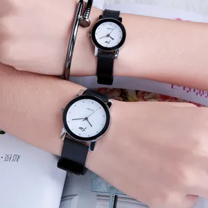 Minimalist quartz wristwatches with black straps and silver cases plus a nail bracelet
