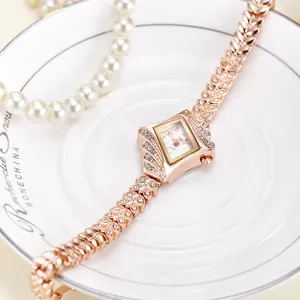 Elegant rose gold rectangle quartz watch with diamond-set case and leaf-link strap