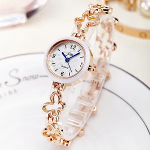 Women's rose gold quartz watch featuring a unique cutout butterfly link bracelet strap