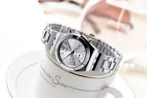 Close-up of GEDI silver quartz watch with functional sub-dials and metal link strap