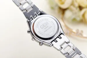 Detail of GEDI stainless steel watch case back with model YH-5101 and metal chain strap