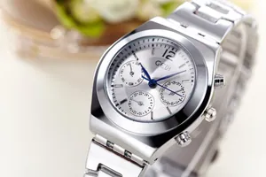 Detail of GEDI steel watch with blue hands, triple sub-dials, and polished silver finish
