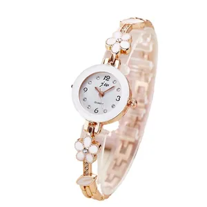 Elegante orologio al quarzo dorato da donna con cinturino floreale e strass lucidi