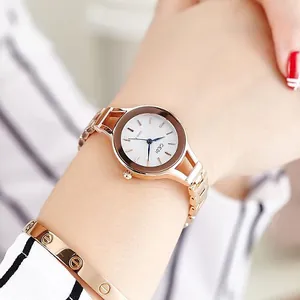 Elegant rose gold watch and screw-patterned bracelet set for women shown on a wrist