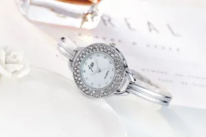 Detailed macro shot of silver quartz bracelet watch with double-row rhinestone bezel decoration