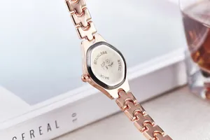 Detail of rose gold watch back with stainless steel casing on a lifestyle background