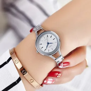 GEDI women's silver steel quartz watch with white sunray dial and blue hands on wrist