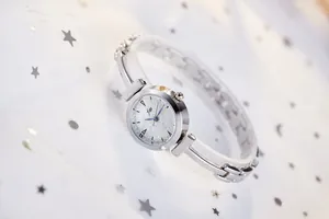 Silver fashion watch for women with starburst glitter dial and T-shaped chain links