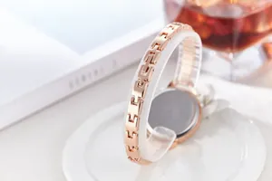 Detail view of rose gold chain watch strap showing secure metal clasp and elegant finish