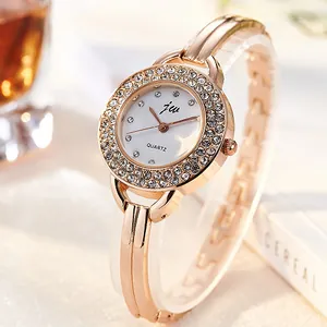 Elegant rose gold women's watch with rhinestone bezel and white quartz dial on bracelet