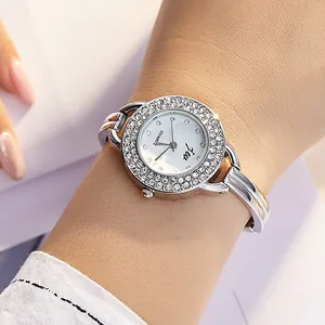 Elegant women's silver quartz watch with rhinestone bezel and metal bracelet band